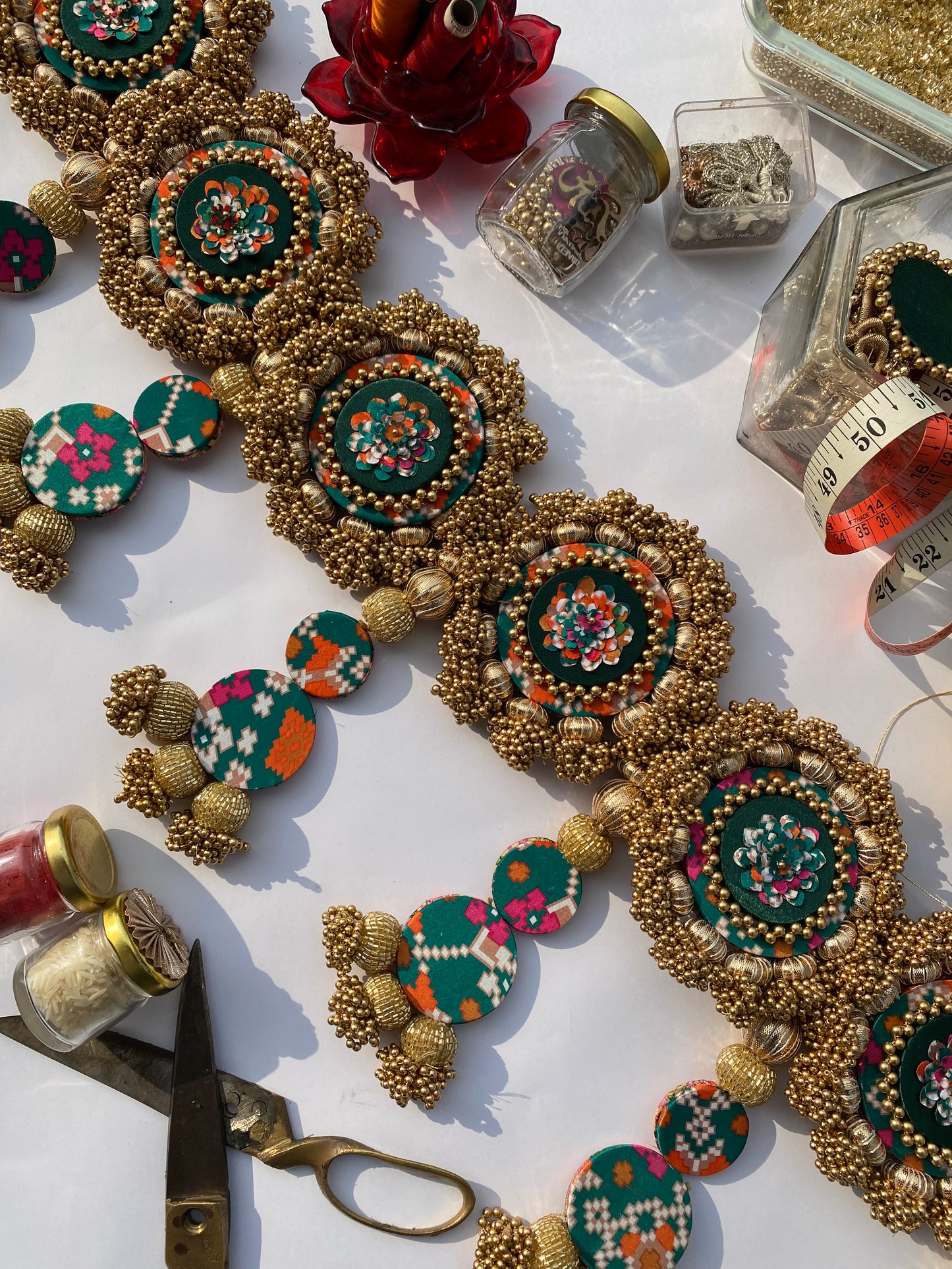 Chic-O-Fleek Dangler Colossal Toran (37 inches): Bottle Green Navratna Patola & OG Inflorescence Divine Pichwai Toran (Flexible)