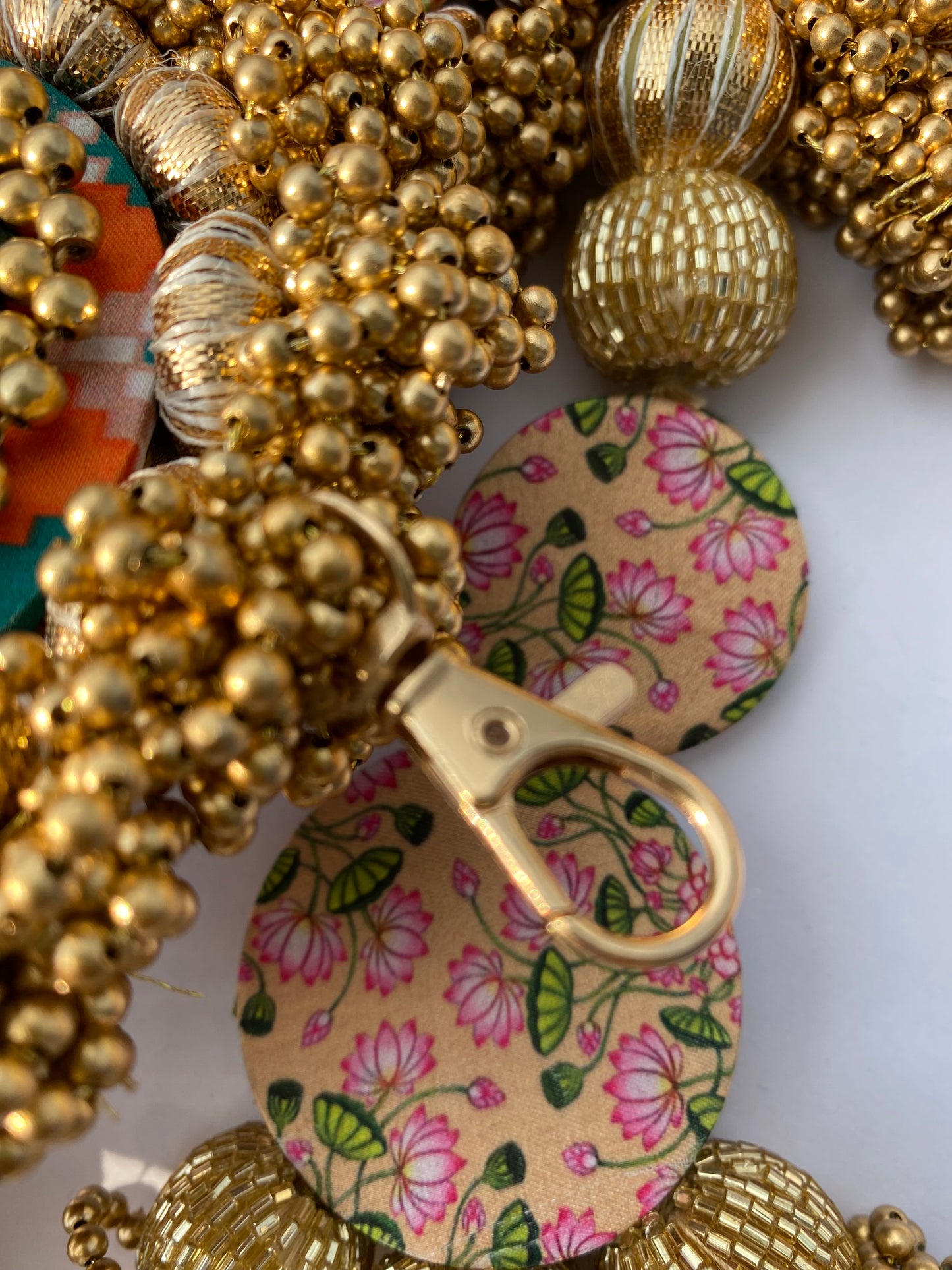 Chic-O-Fleek Dangler Colossal Toran (37 inches): Bottle Green Navratna Patola & OG Inflorescence Divine Pichwai Toran (Flexible)
