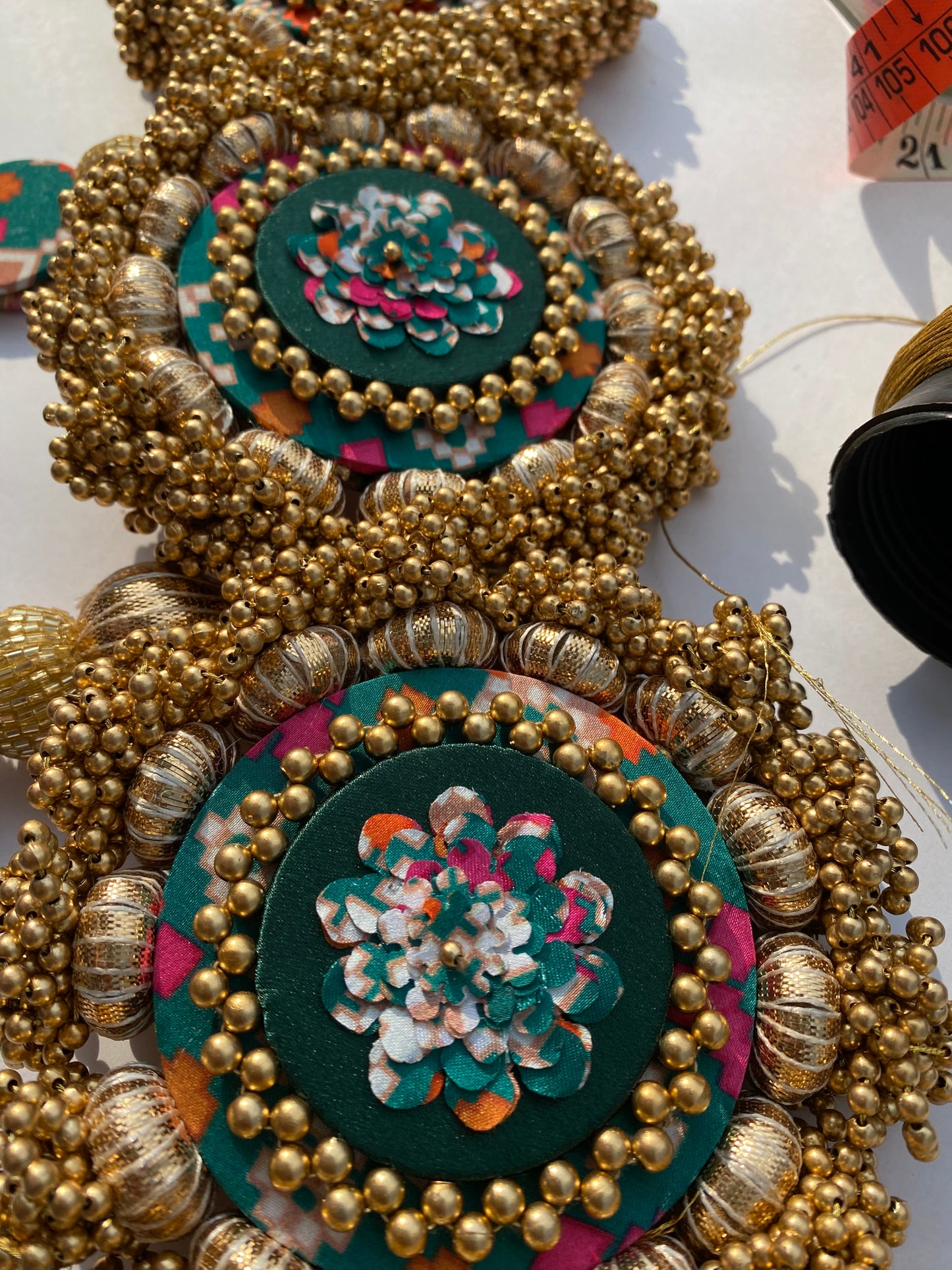 Chic-O-Fleek Dangler Colossal Toran (37 inches): Bottle Green Navratna Patola & OG Inflorescence Divine Pichwai Toran (Flexible)