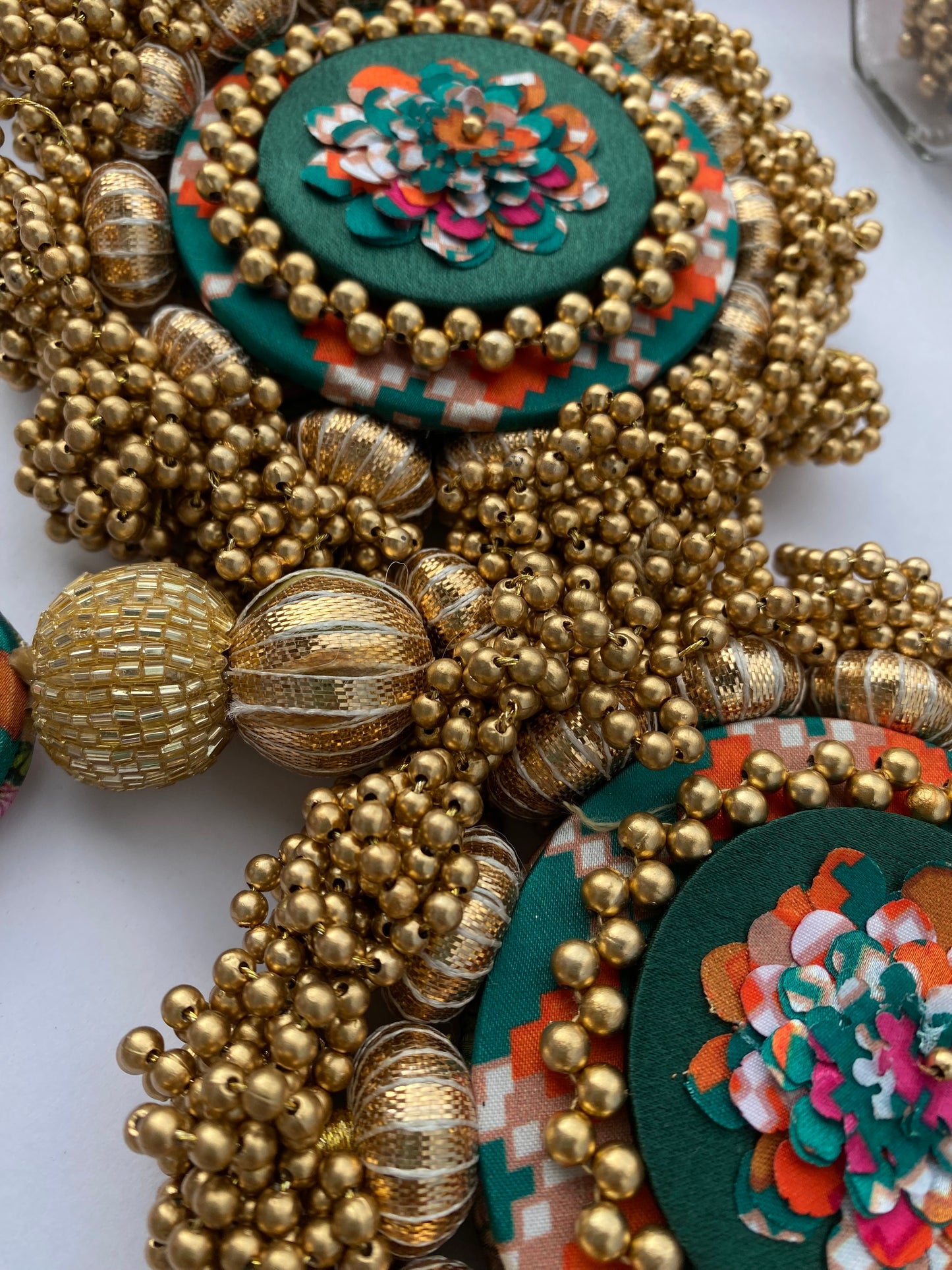 Chic-O-Fleek Dangler Colossal Toran (37 inches): Bottle Green Navratna Patola & OG Inflorescence Divine Pichwai Toran (Flexible)
