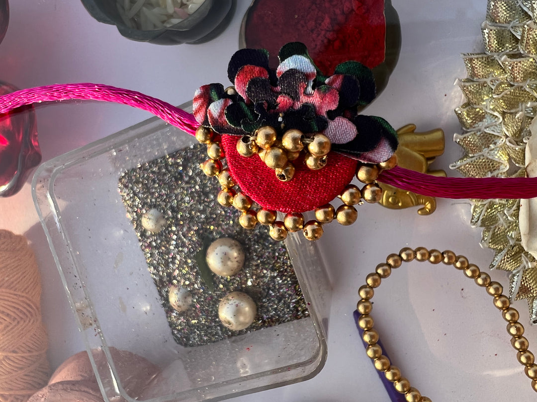 Pink Navratna Patola Half Pollen Enchanted Rakhi