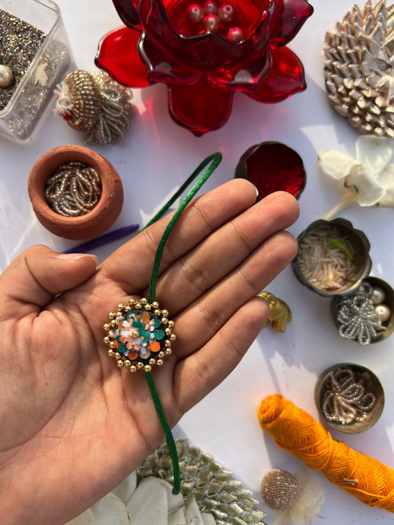Maroon Navratna Patola Mini Beaded Enchanted Rakhi
