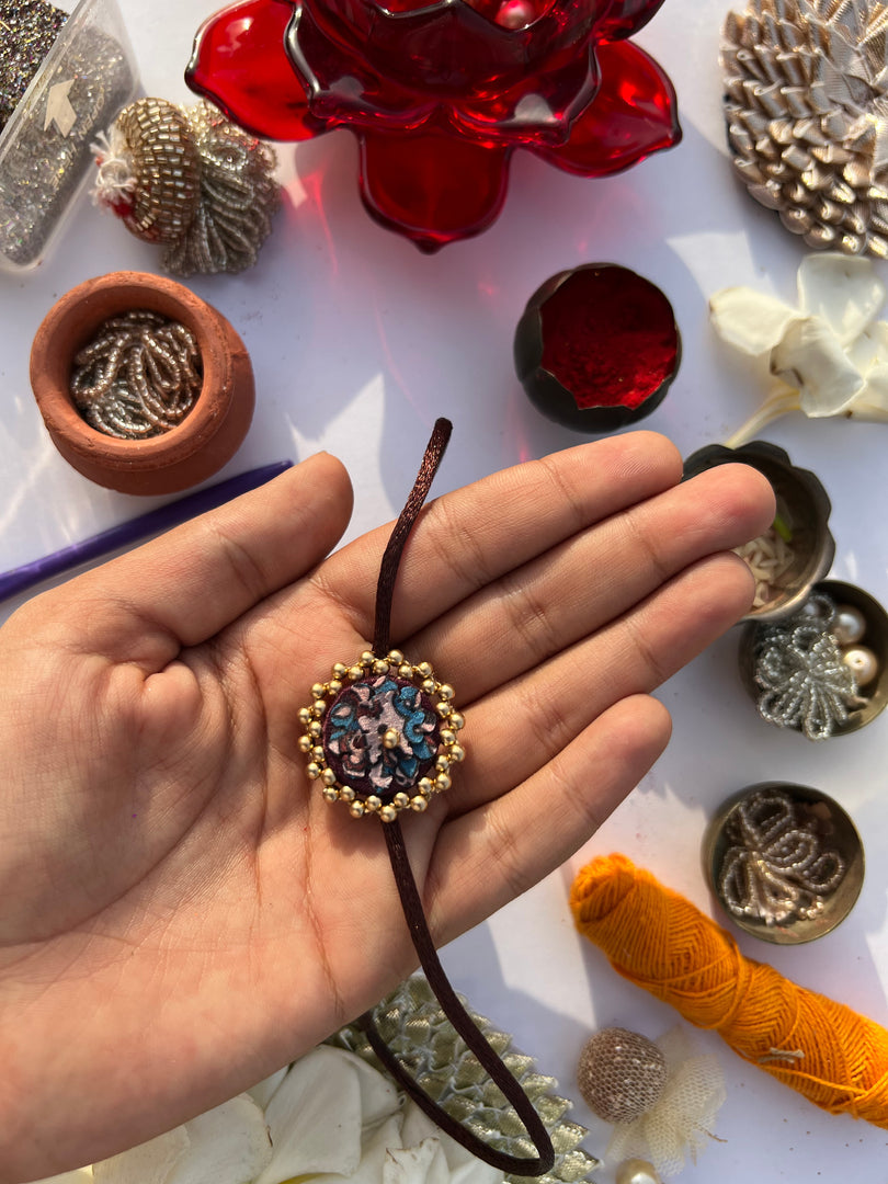 Maroon Navratna Patola Mini Beaded Enchanted Rakhi