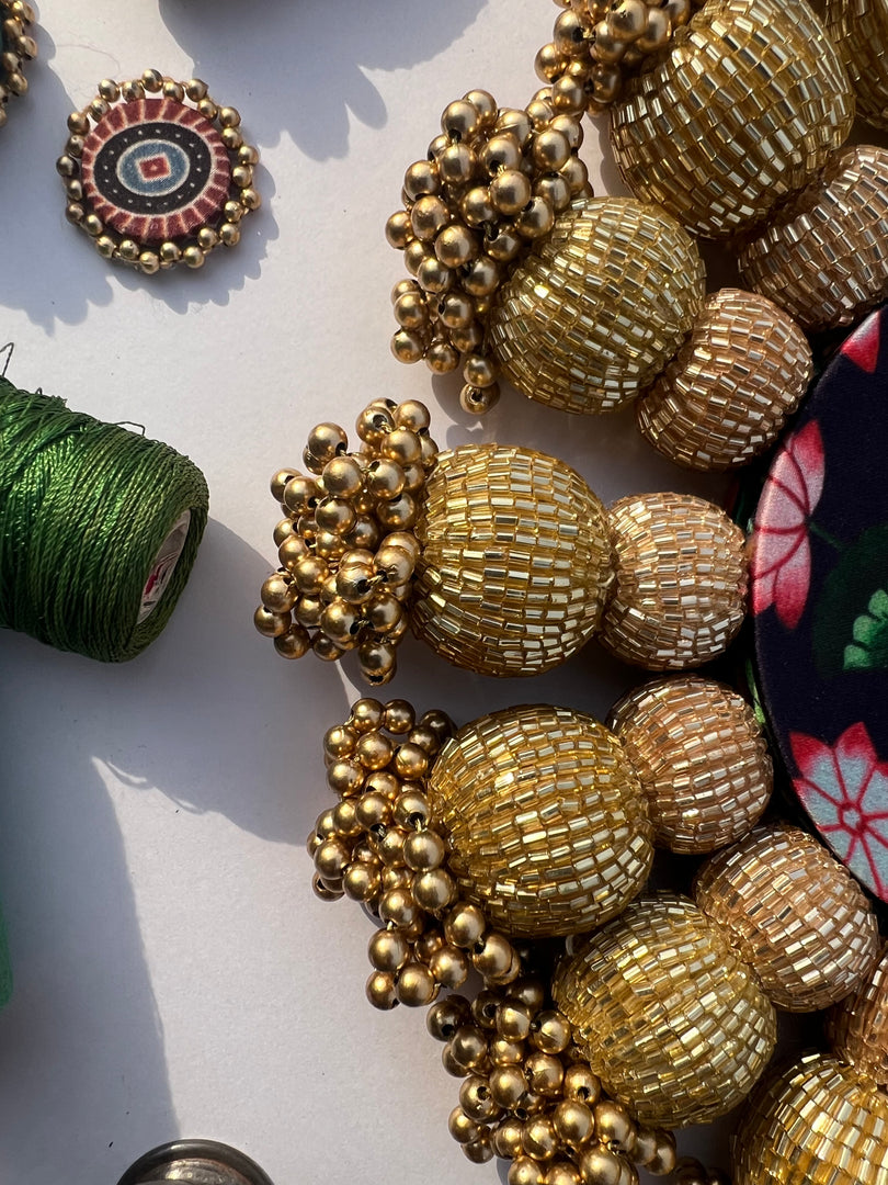Spherical Chaandbali OG Inflorescence Divine Pichwai and Maroon Navratna Patola Diya Pallet