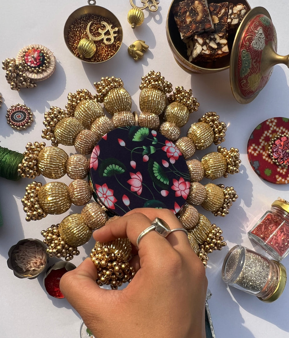 Spherical Chaandbali OG Inflorescence Divine Pichwai and Maroon Navratna Patola Diya Pallet