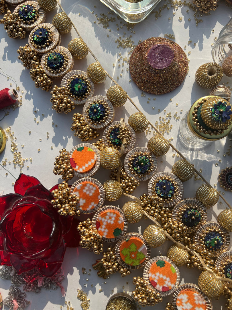 The Ready To Glam Vermillion + Yellow Congruous Divine Pichwai Glass Lumba Toran (Flexible)