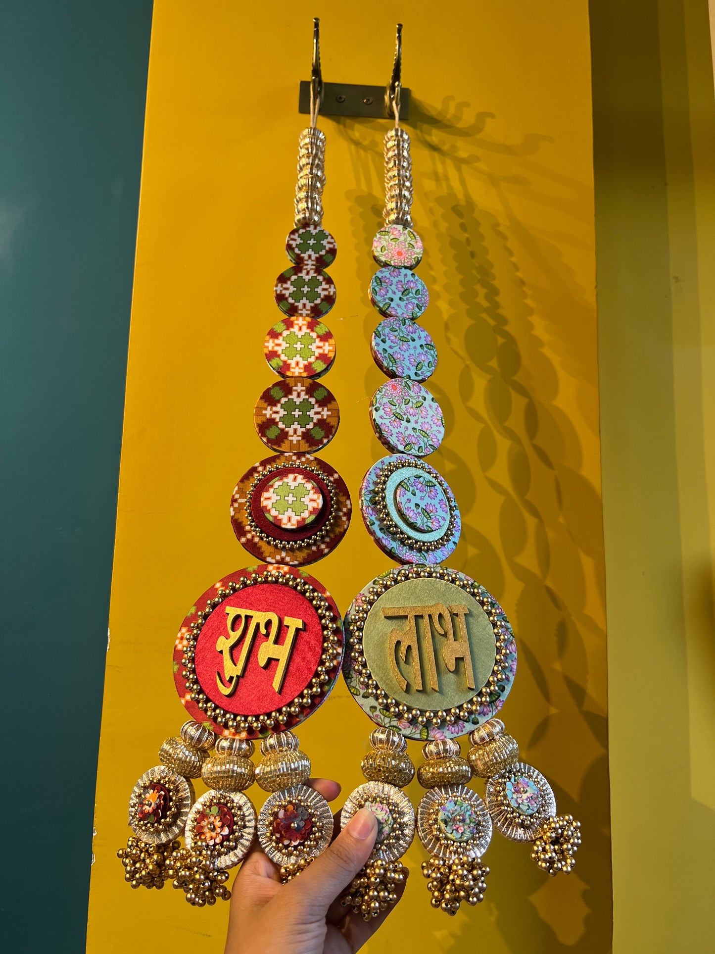 Awe-inspiring Shubh labh : Maroon Navratna Patola + Pastel Pistachio Infloresence Divine Pichwai