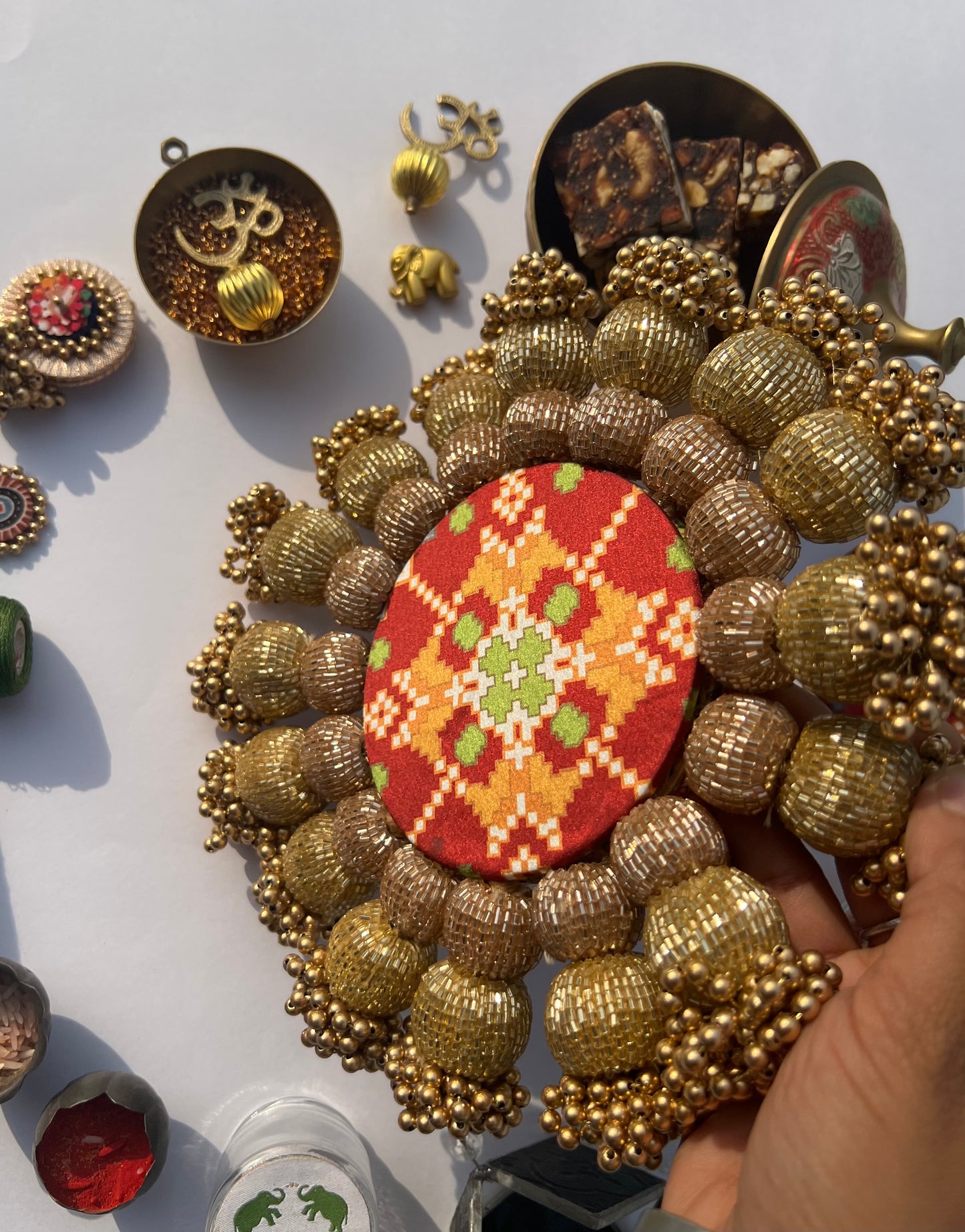 Spherical Chaandbali OG Inflorescence Divine Pichwai and Maroon Navratna Patola Diya Pallet
