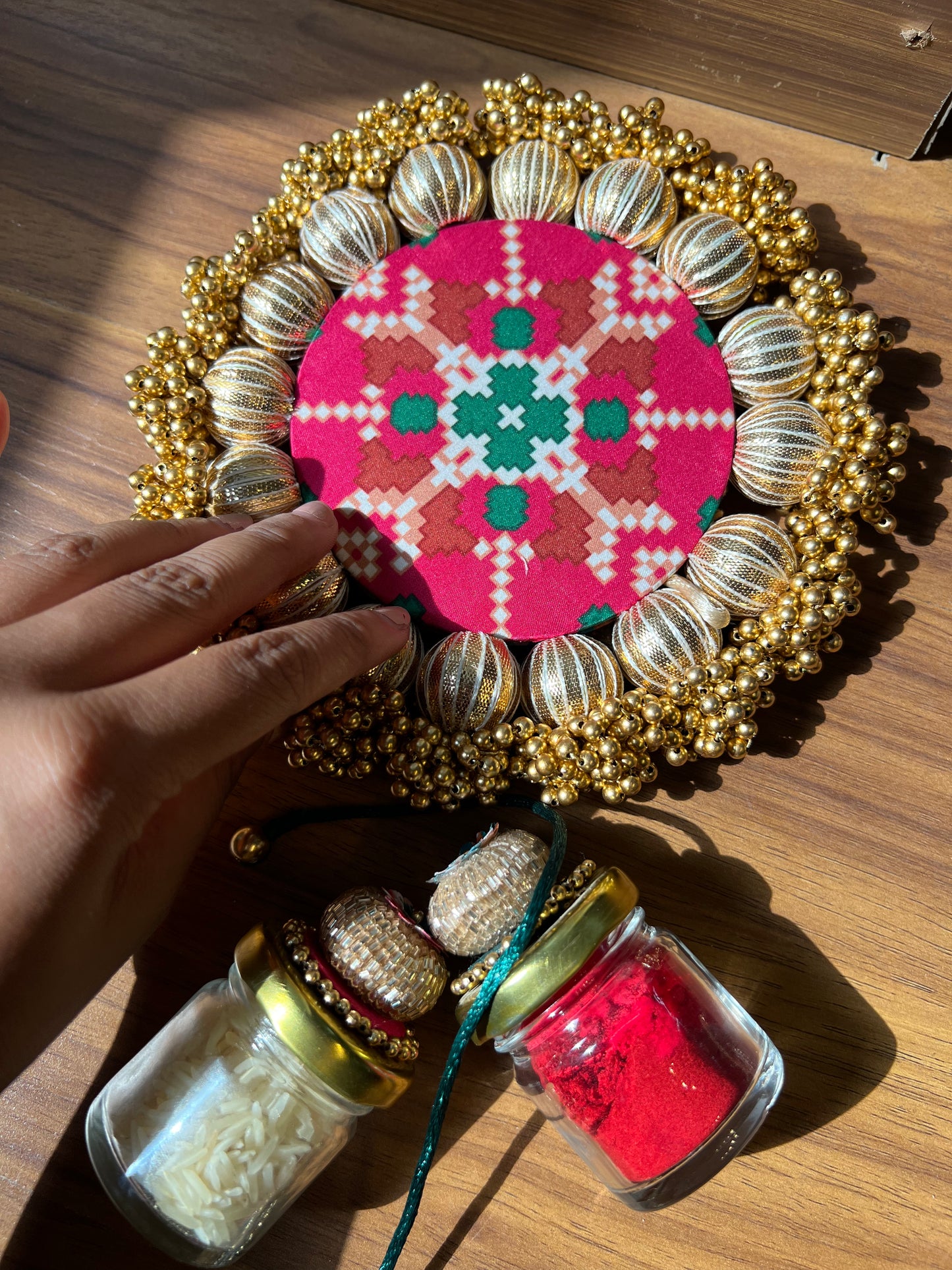 Joker Poker Rakhi set: Bottle Green + Pink Navratna Patola