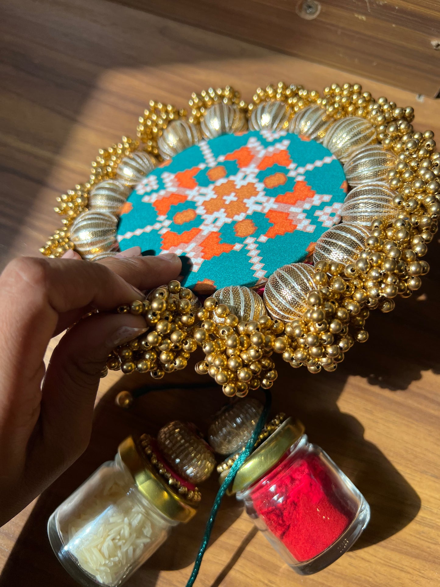 Joker Poker Rakhi set: Bottle Green + Pink Navratna Patola