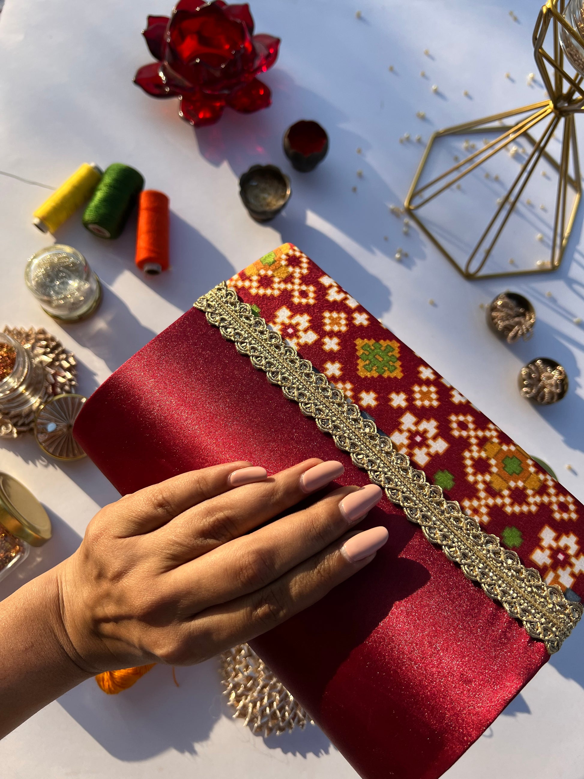 Sylphlike Maroon Navratna Patola Micro Beaded X Solid Silk Clutch