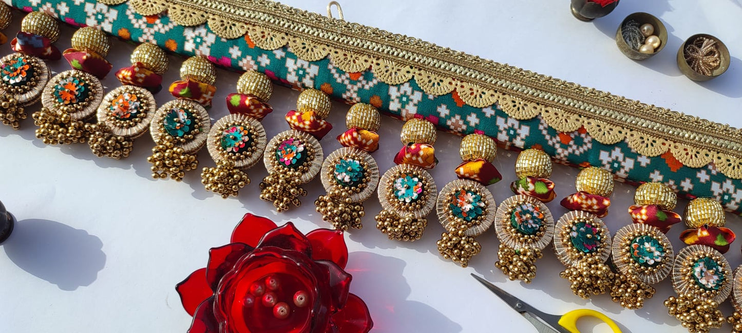 SLEEK: Maroon & Bottle Green Navratna Patola Plumeria Toran (SOLID)