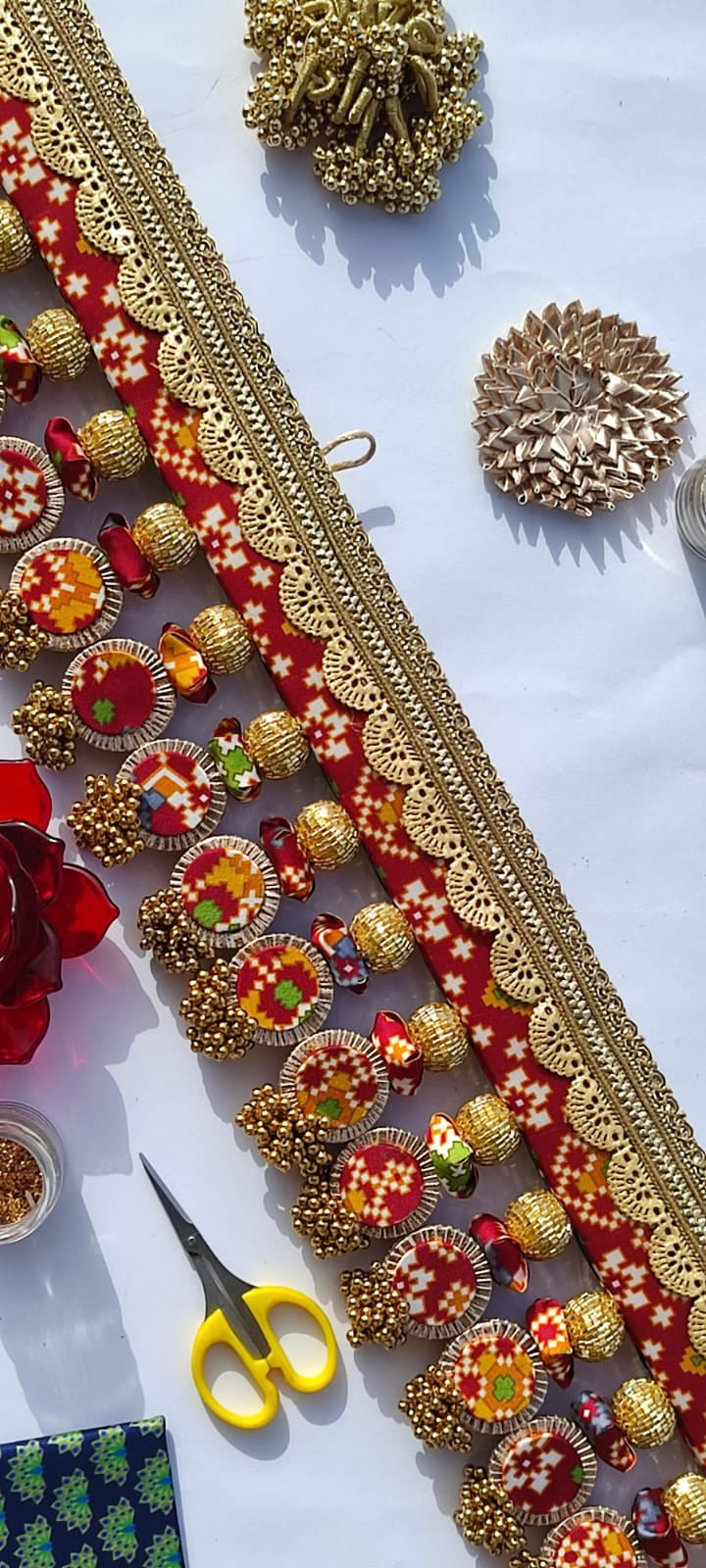SLEEK: Maroon & Bottle Green Navratna Patola Plumeria Toran (SOLID)