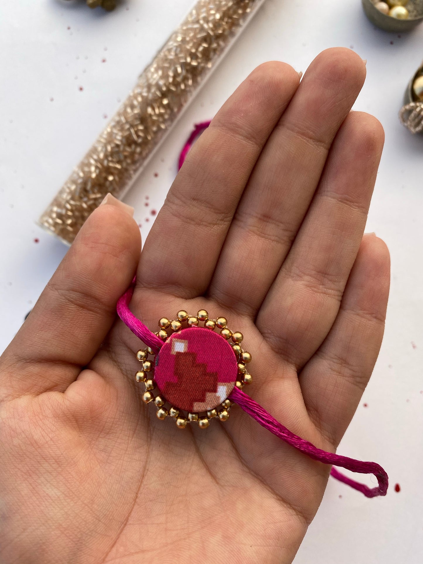 Miniature Pink Navratna Patola Enchanted Prakash Rakhi