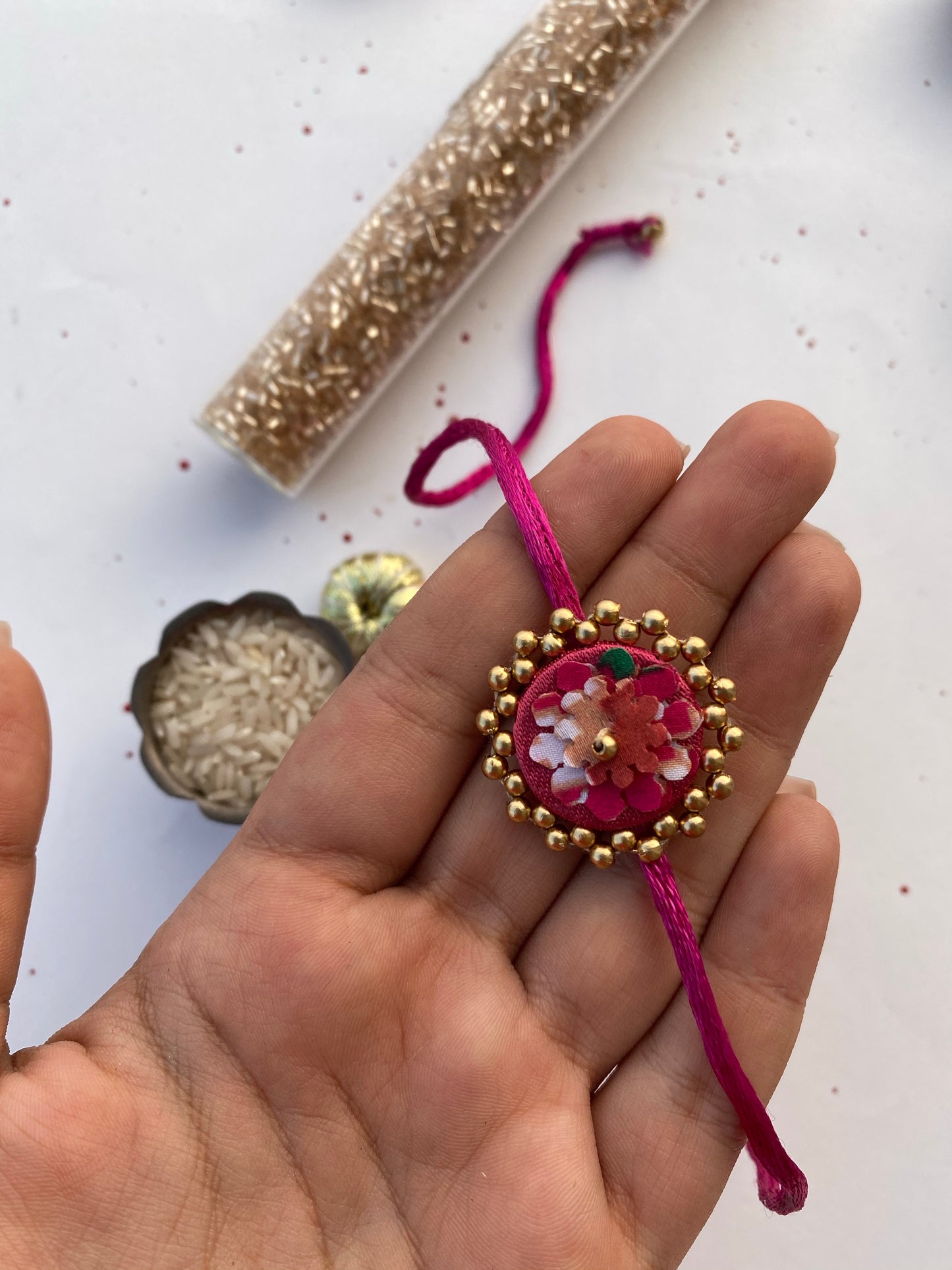 Miniature Pink Navratna Patola Enchanted Prakash Rakhi