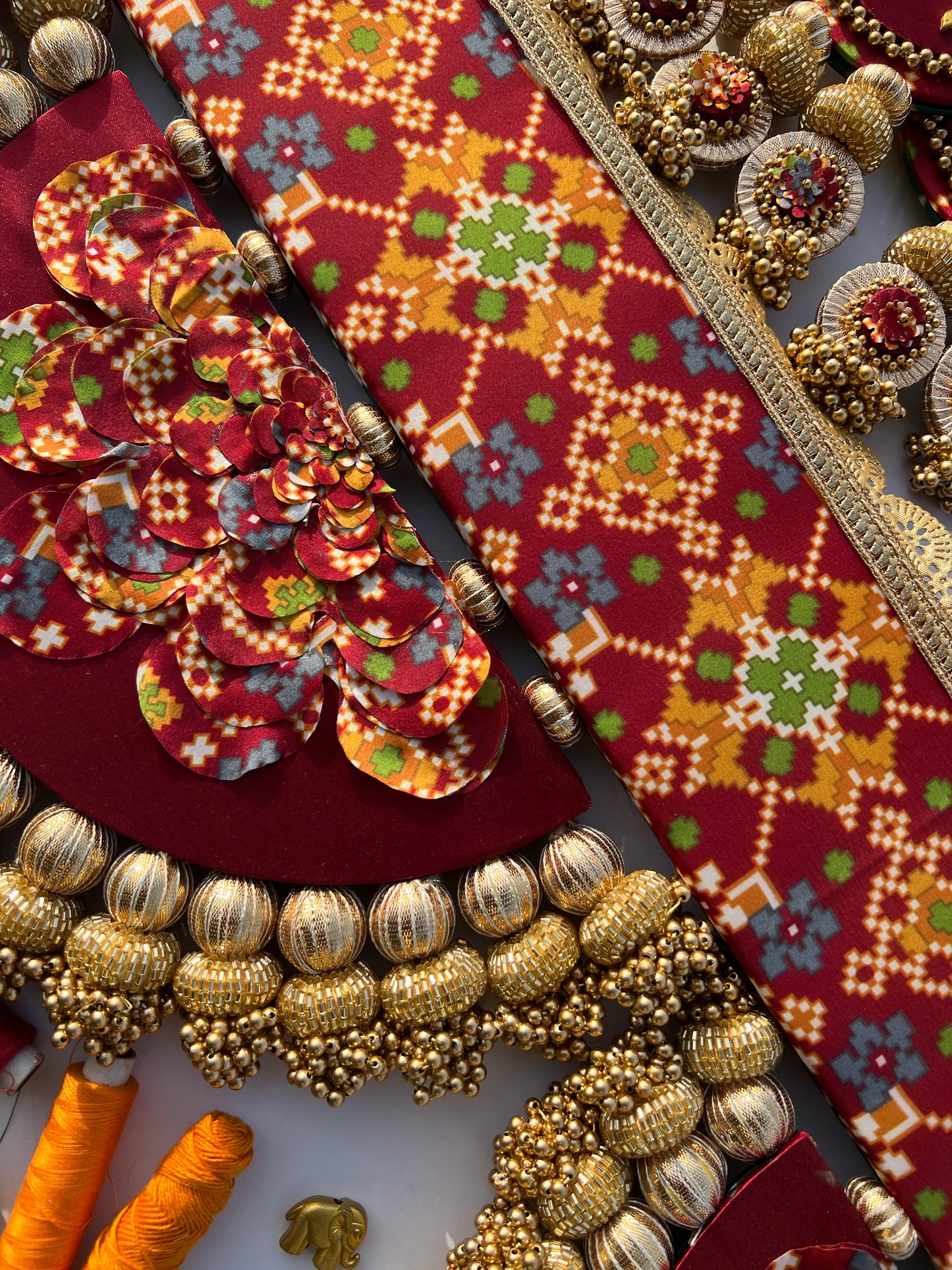 The Enchanted Chandbali: Maroon & Bottle Green Navratna Patola Two Way Toran (SOLID)