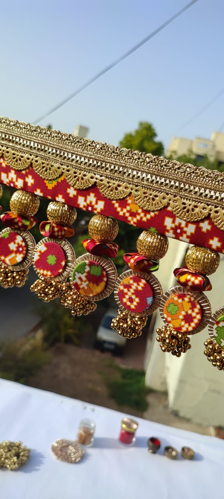 SLEEK: Maroon & Bottle Green Navratna Patola Plumeria Toran (SOLID)