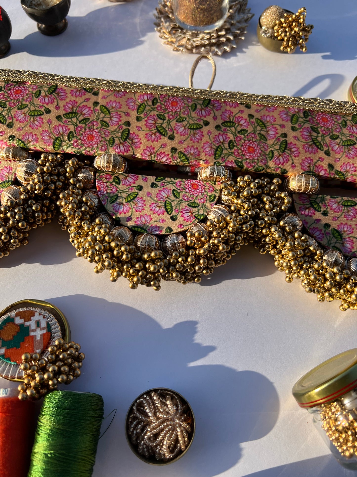THE SLEEK: Maroon Navratna Patola X Solid Beaded Arcs and Inflorescence Divine Pichwai Toran for home decor