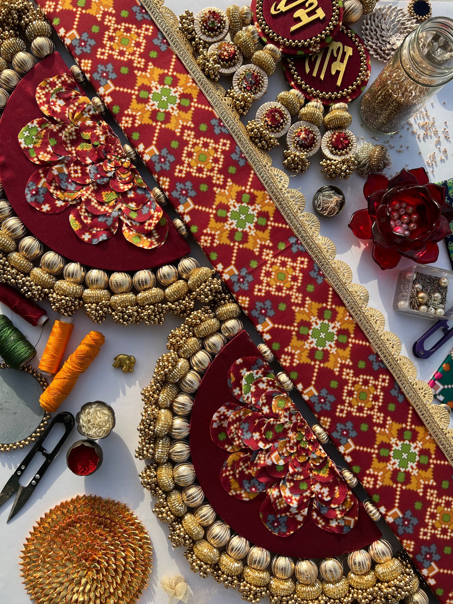 The Enchanted Chandbali: Maroon & Bottle Green Navratna Patola Two Way Toran (SOLID)