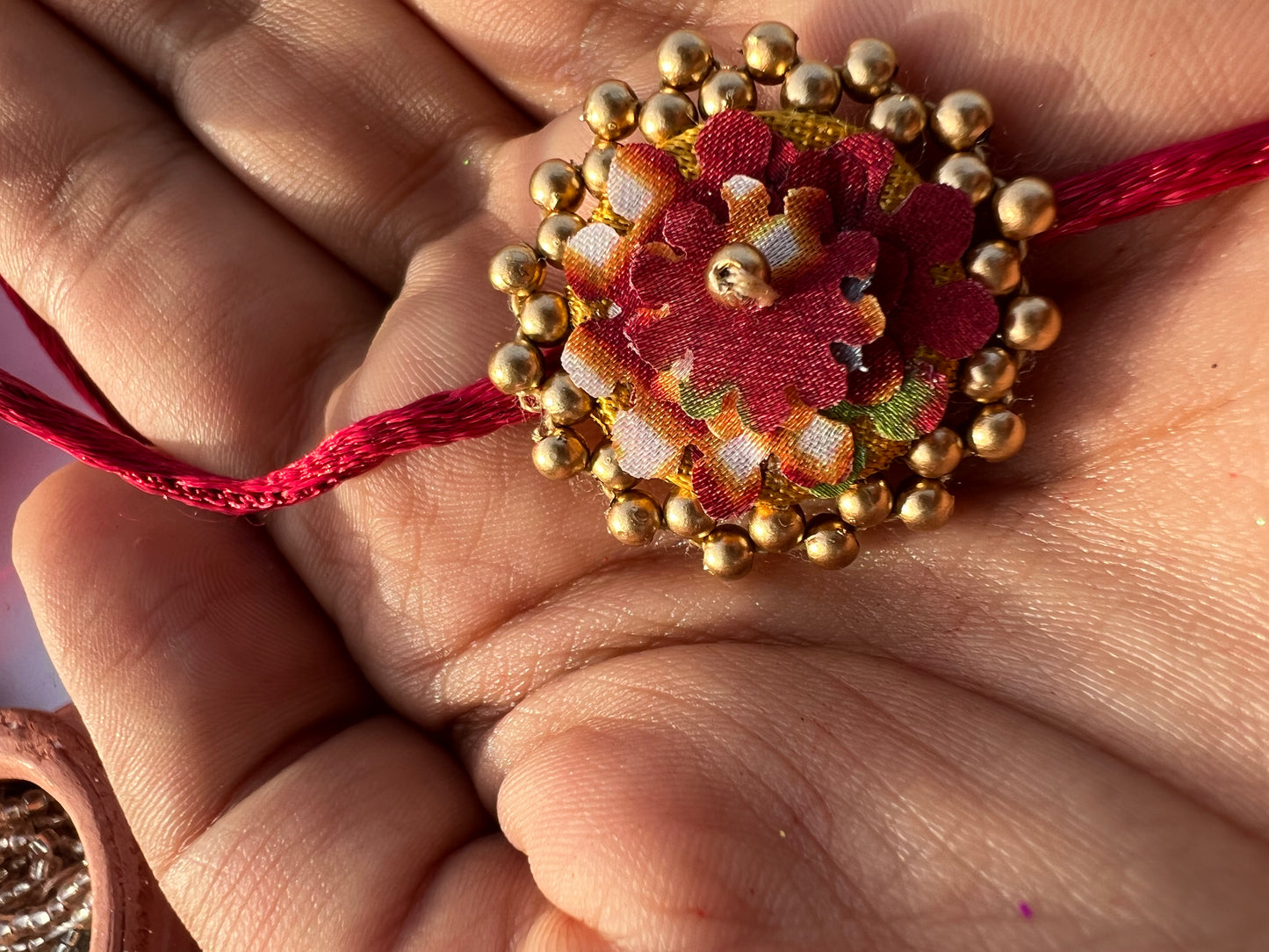 Maroon Navratna Patola Mini Beaded Enchanted Rakhi