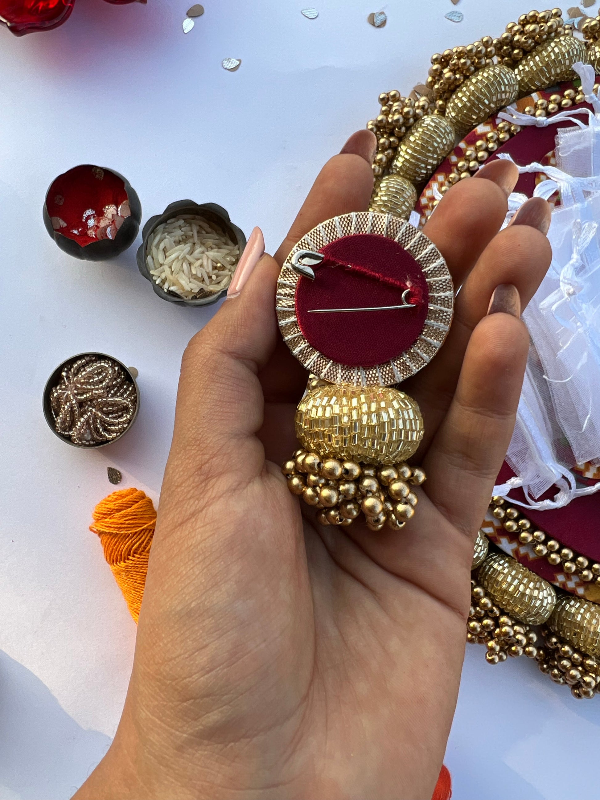 Enchanted Maroon Navratna Patola Beaded Brooch