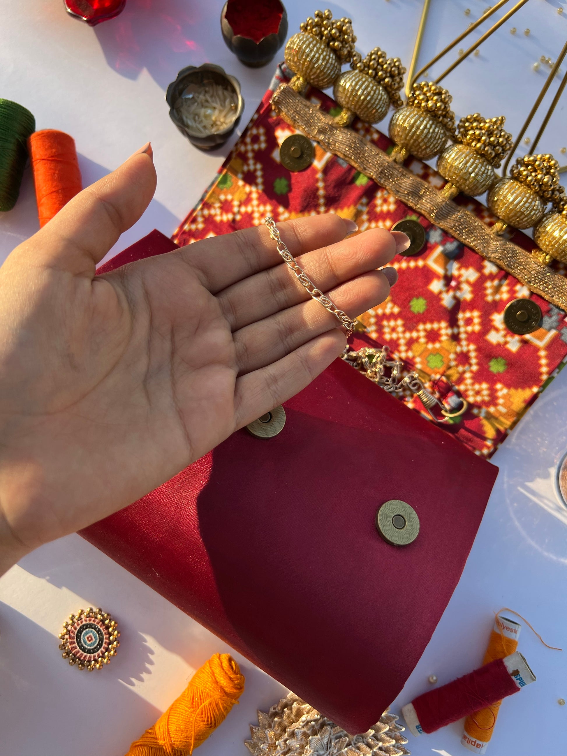 Sylphlike Maroon Navratna Patola Micro Beaded X Solid Silk Clutch