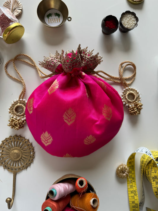 GulPatra potli bag in pink with gold leaf motifs – softly padded and handmade, ideal for wedding favors and festive gifting by IBHI.

