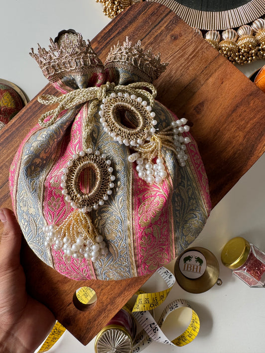 ChandiGul potli bag in soft light pink and baby grey tones with drawstring closure – perfect for wedding favors, baby showers, and elegant gifting by IBHI.

