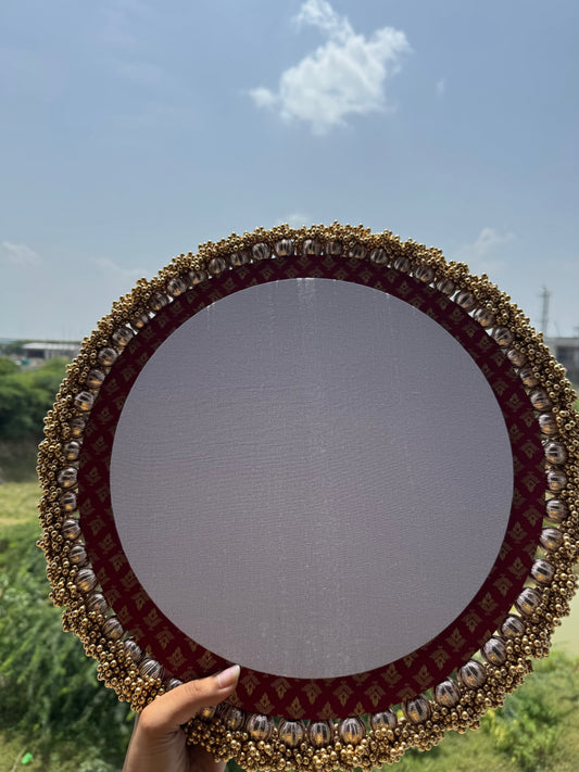 Maroon Banarasi Kumkum Pagla Platter with decorative border for bride's first footprints – handcrafted for wedding and Grah Pravesh rituals.

