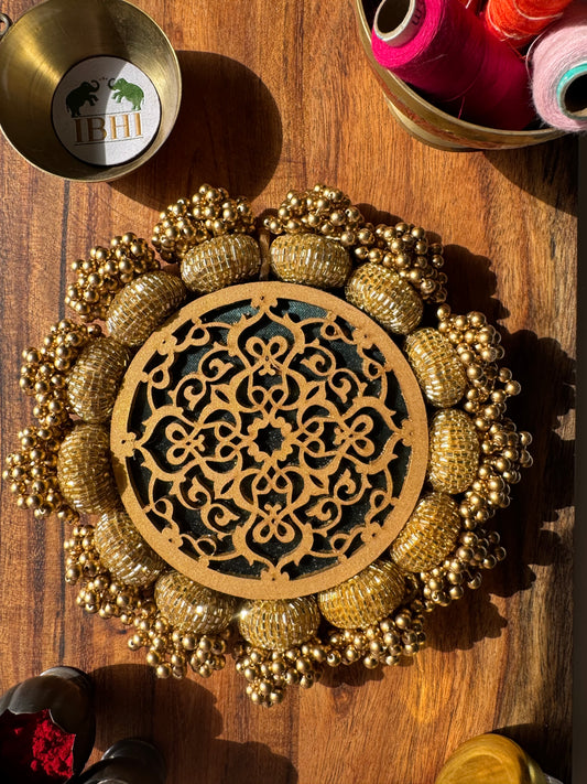 Handmade green and gold round pallet with jaal design and Patola print


