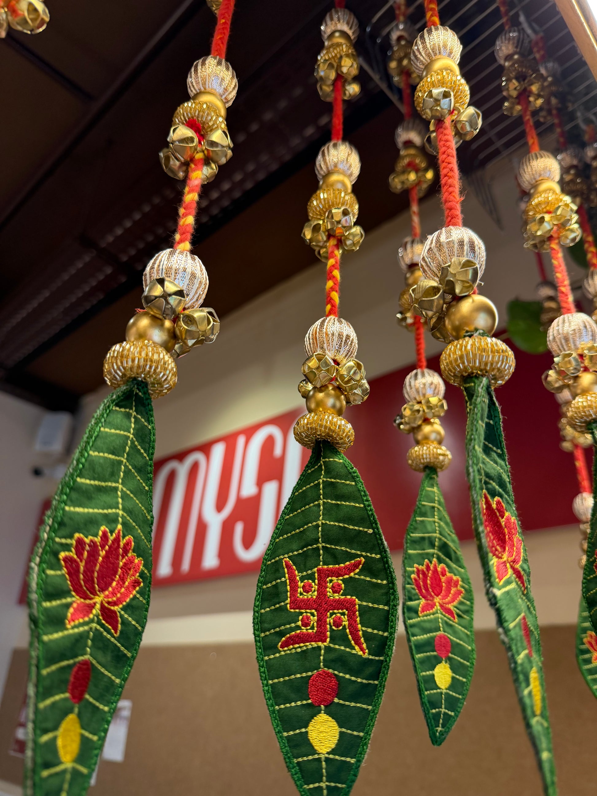 Handcrafted mango leaf festive hanging with kalawa thread, gota patti, glass beads and ghungroos by IBHI