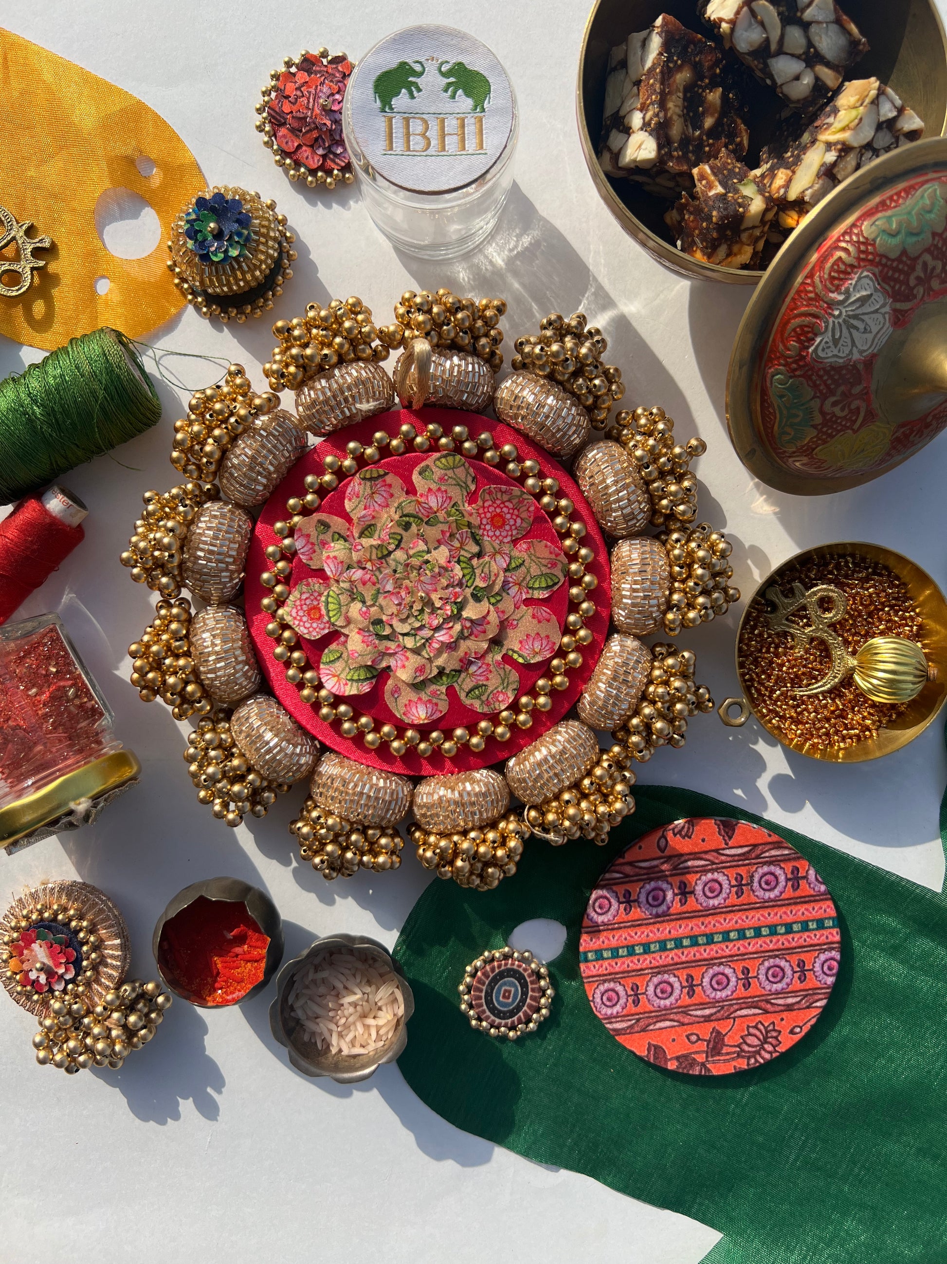Pichwai bloom platter with pink silk and hand-stitched tassels