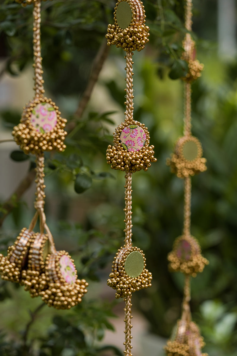 Pista Noor pastel green and muted yellow handcrafted Indian hanging with Pichwai motifs and beadwork by IBHI