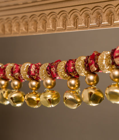 Tonal maroon Banarasi flower toran on solid maroon silk base, with ghunghroos and glass beads — handmade Petite Gajra Toran by IBHI
