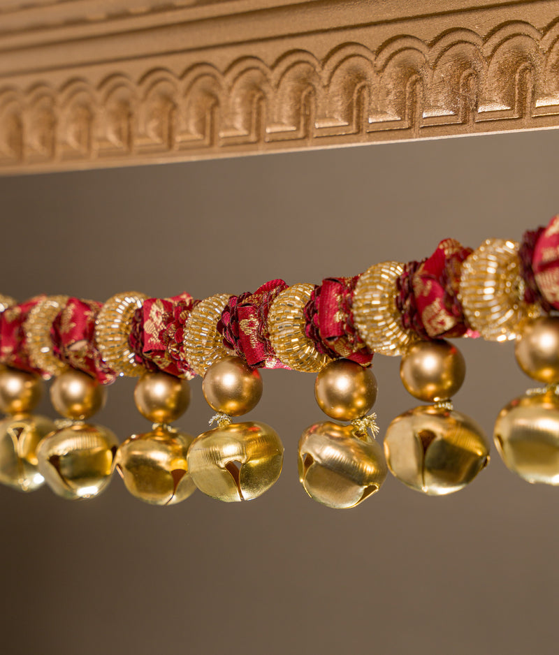 Tonal maroon Banarasi flower toran on solid maroon silk base, with ghunghroos and glass beads — handmade Petite Gajra Toran by IBHI