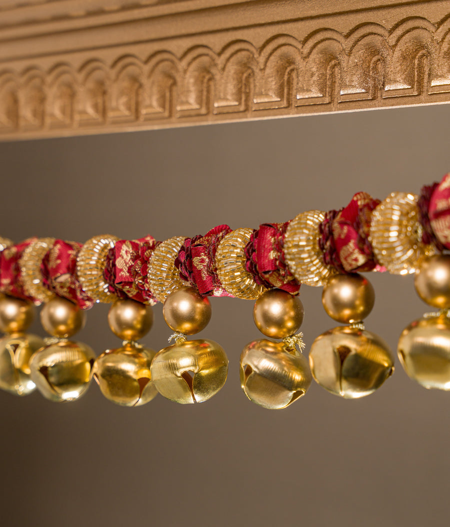 Tonal maroon Banarasi flower toran on solid maroon silk base, with ghunghroos and glass beads — handmade Petite Gajra Toran by IBHI