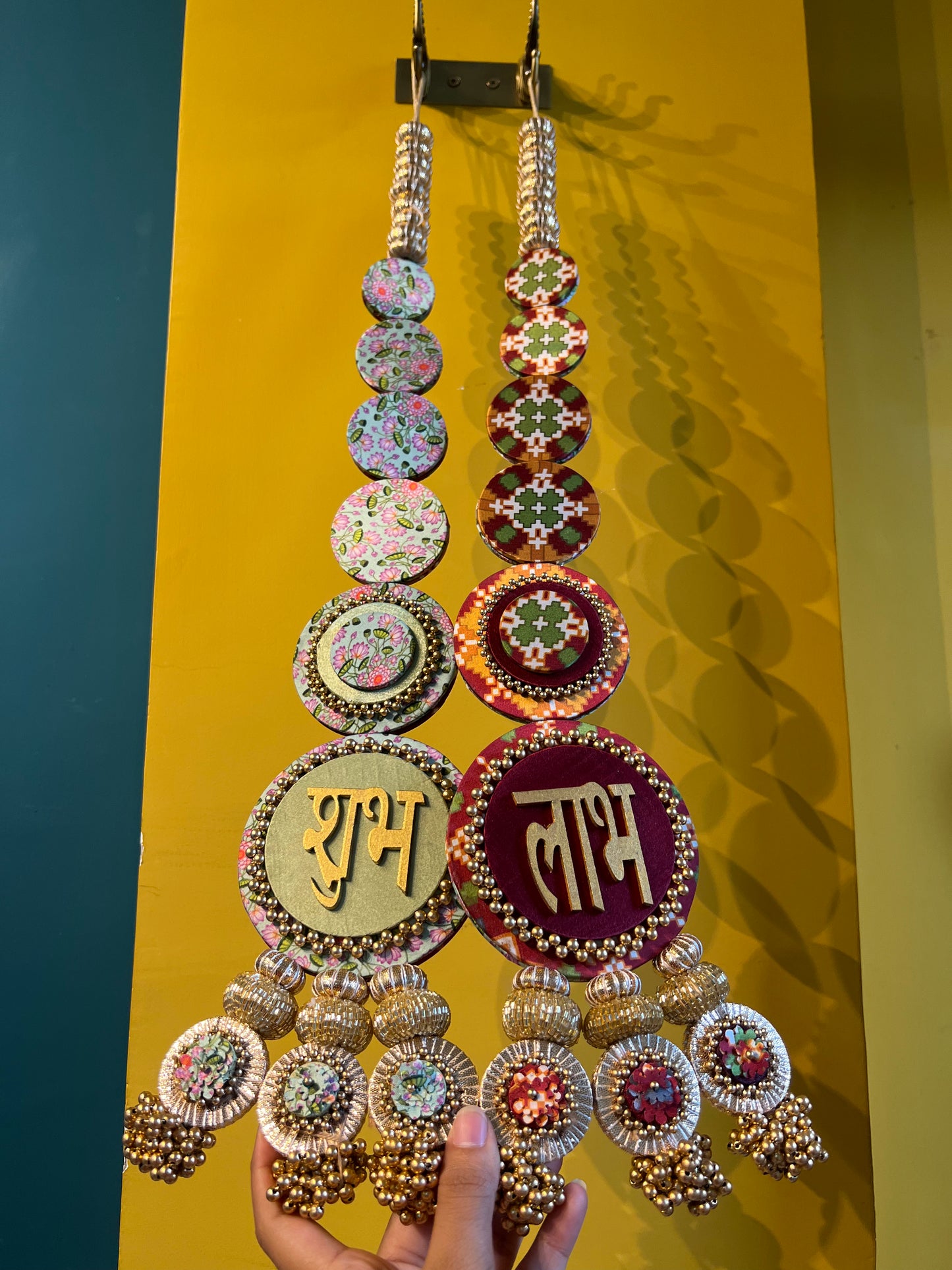 Awe-inspiring Shubh labh : Maroon Navratna Patola + Pastel Pistachio Infloresence Divine Pichwai