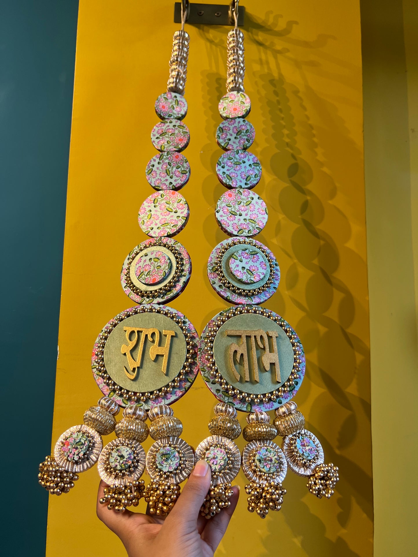 Awe-inspiring Shubh labh : Maroon Navratna Patola + Pastel Pistachio Infloresence Divine Pichwai