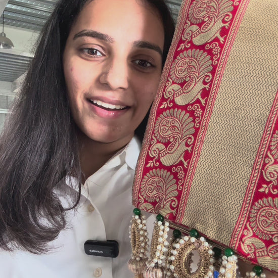 Morlal khes with red base, gold peacock borders, chevron center, maroon butti back, crochet and pearl tassels – perfect for wedding rituals

