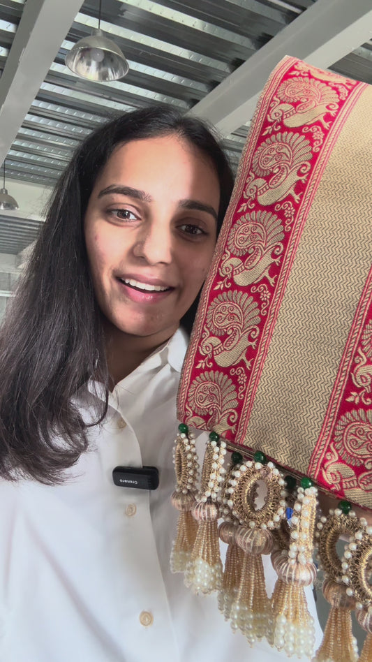 Morlal khes with red base, gold peacock borders, chevron center, maroon butti back, crochet and pearl tassels – perfect for wedding rituals

