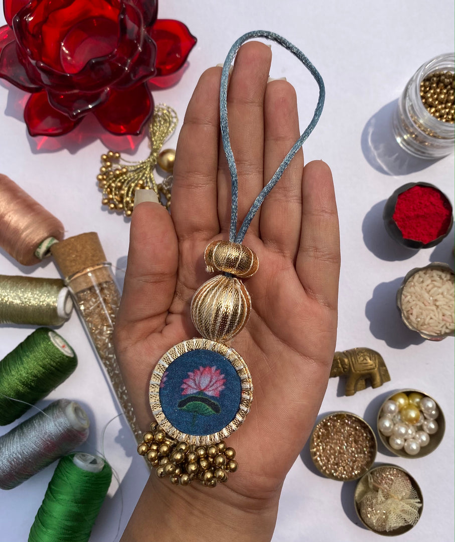 Idiosyncratic Divine Pichwai Couple Rakhi Ensemble II