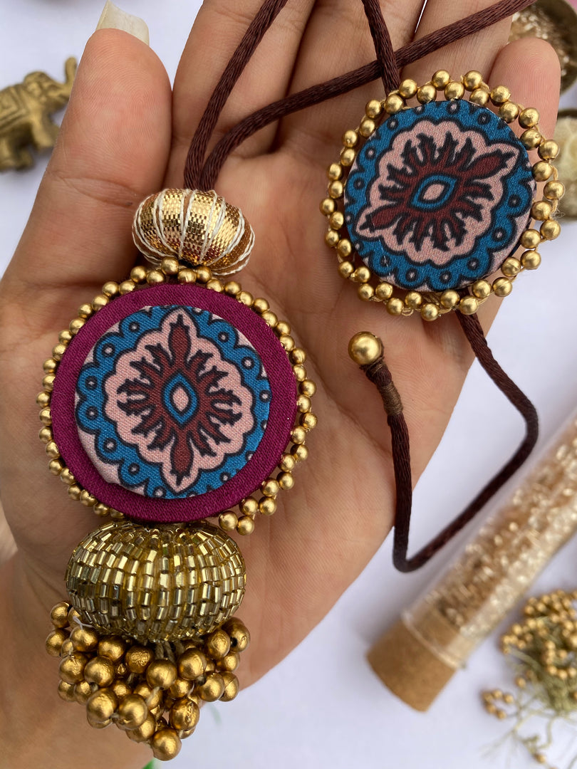 Upended Confluence Beaded Silk Thread Lumba & Beaded Emblem Rakhi