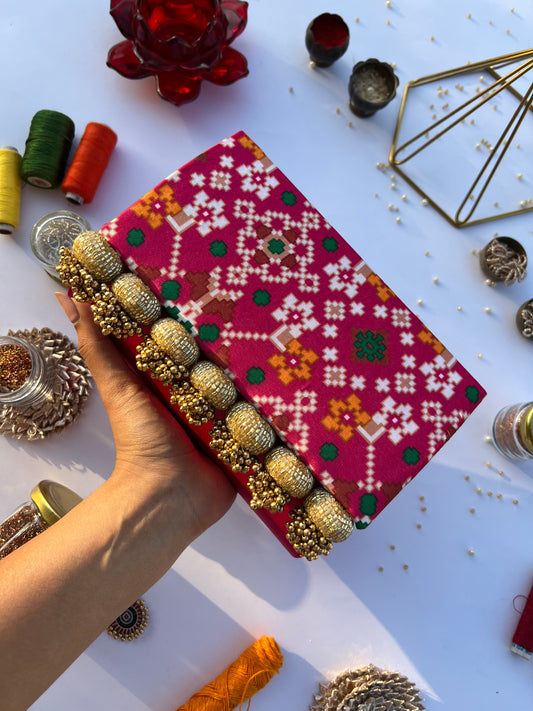 patola printed braded clutch for party.