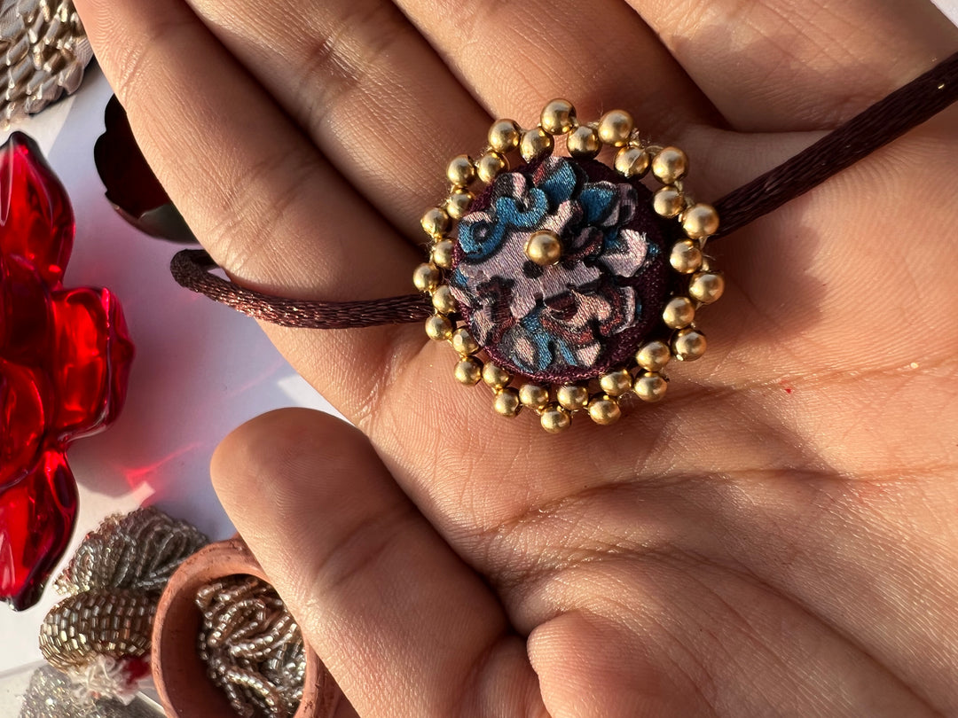 Octagonal Blossom Intense Ajrakh Mini Beaded Enchanted Rakhi