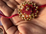Load image into Gallery viewer, Maroon Navratna Patola Mini Beaded Enchanted Rakhi
