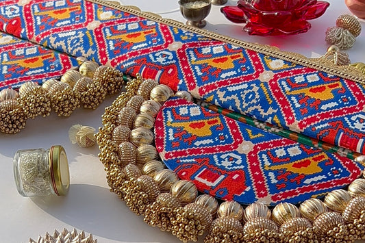 The Enchanted Chandbali: Bottle Green Navratna & Royal Blue Hathi Popat Patola Two Way Toran (SOLID)