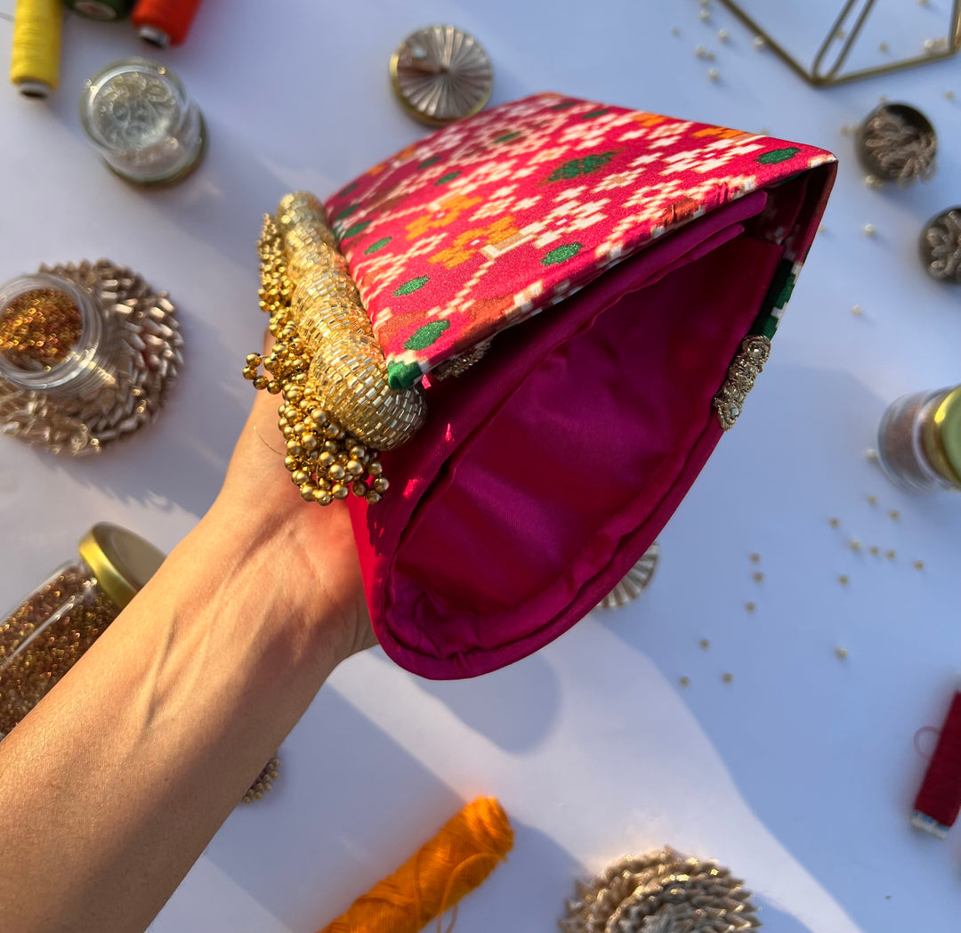 patola printed braded clutch for party.