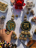 Load image into Gallery viewer, Bottle Green Navratna Patola &amp; Vermillion Congruous Divine Pichwai Shubh Labh Danglers- Set of 2

