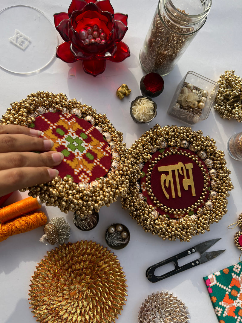 Maroon Navratna Patola Beaded Shubh Labh Pallets- Set of two