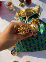 Load image into Gallery viewer, Peacock print pointed edge potli for gifting.